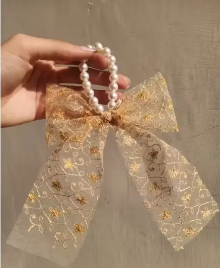 Gold design bow shaped hair band